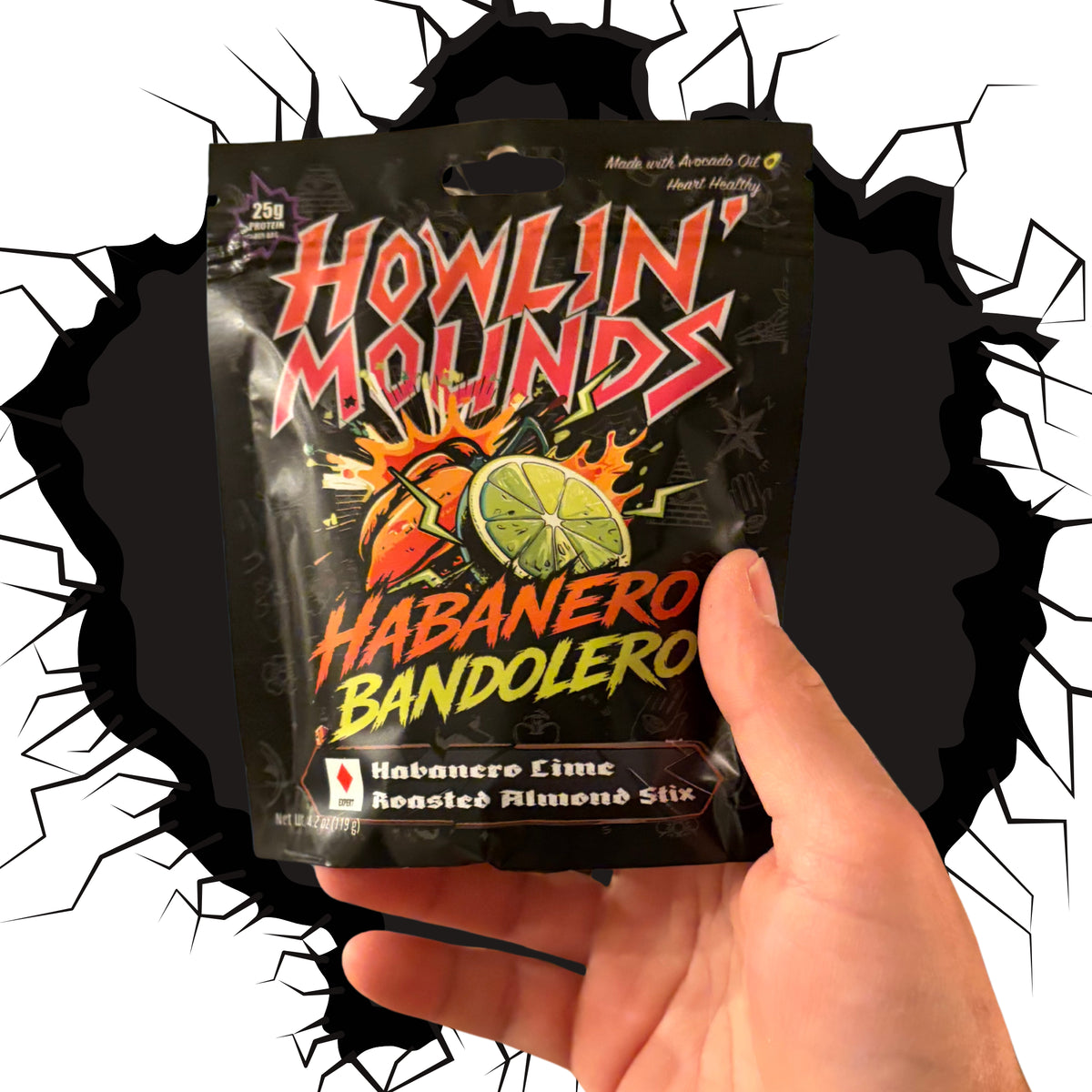 Hand holding a bag of Habanero Bandolero spicy almond stix