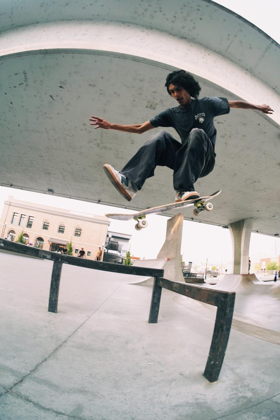 Skater boardsliding a rail