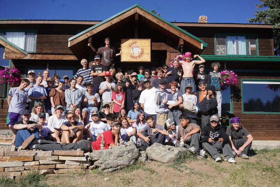 Large SkateLife Idaho group photo outside a lodge